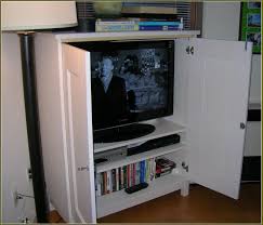 This entertainment center will hide your tv when not in use. Wall Mount Tv Cabinet With Doors Front Design