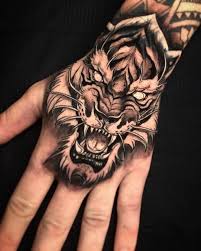 15 Best Tiger Head Tattoo Designs And Ideas Petpress Hand Tattoos For Guys Tiger Head Tattoo Hand Tattoos