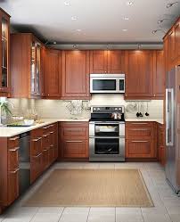 As you can see, this small kitchen looks more spacious with light cherry cabinet and light brown floorings. 13 Ways To Modernize Cherry Kitchen Cabinets For Less