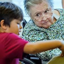 Older Murrieta residents enjoy books with students