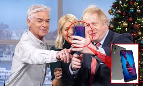 Cabinet secretary simon case is believed to have made the recommendation last year, but the prime minister rejected the advice, according to the times. Boris Johnson Uses Huawei Phone On Tv Despite 5g Security Fears Daily Mail Online