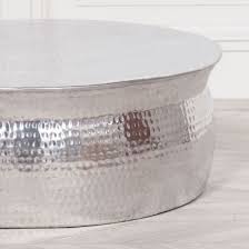 Add style to your home, with pieces that add to your decor while providing hidden storage. Shiny Silver Low Round Coffee Table Finish Hammered Aluminium