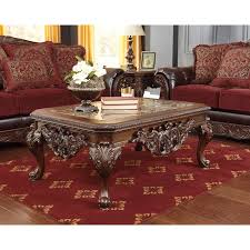 Coffee table includes casters for easy mobility. Florimar Occasional Table Set Signature Design In Occasional Table Sets Alive With The Elegant Beauty Of Old World Des Coffee Table Furniture Ashley Furniture