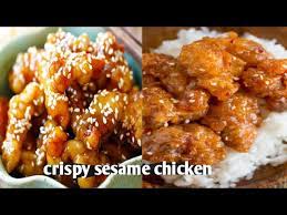 Updated for 2018 with video! Crispy Sesame Chicken With A Sticky Asian Sauce Served With Noodles Youtube