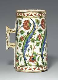 A Large Iznik Pottery Tankard Ottoman Turkey Circa 1640 Of Tapering Cylindrical Form With Angular Handle The White Body Decorated With Vazolar Comlek Sanat