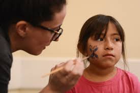 Families get pick of donated gifts at Woman's Club party