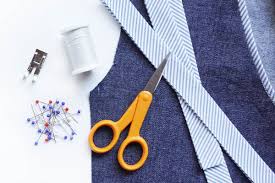 Take the shirt, turn it inside out, and sew the pinned v into place with a basis stitch to connect the fabrics together. How To Sew Flat Piping Trim To A V Neckline Weallsew
