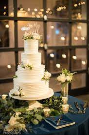 White Wedding Cake In An Industrial Setting Frosted Pumpkin Bakery Atlanta Wedding Photographer Wedding Atlanta Wedding