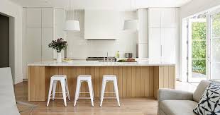 white kitchen warms up with a wood island
