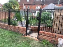 Here white trunked trees stand out against the darker wall and bring height, whilst box balls add lower interest. Wrought Iron Style Metal Garden Fencing Panels Cheap Wrought Iron Style Metal Garden Fencing Panels Online For Sale Metal Gates Direct