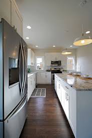L Shaped Kitchen With White Shaker Cabinets Colonial White Granite Countertops Dark Engineered White Granite Countertops L Shaped Kitchen White Kitchen Paint