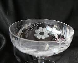 Water goblets from days past are between 6 and 9 inches tall and most will hold around 9 ounces filled right to the brim. Vintage Wheat Floral Etched Glass Dessert Goblet Floral Etched Crystal Dessert Dish Glass Line Etched Wheat Pattern Vintage Dessert Vintage Dessert Vintage Stemware Packing Dishes