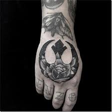 Among them is a killer star wars tattoo of the rebel alliance symbol with leia's face inside/behind it. Star Wars Tattoos Unbelievable Images Nexttattoos