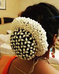 What A Beautiful Large Low Bun With Real Flower Gajra Mesh Cover Care Howev Indian Bridal Hairstyles Bridal Hair Decorations Bridal Hairstyle Indian Wedding