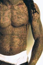 Lil wayne black light tattoo on face. Lifes A Gamble Lil Wayne Wayne Tattoos