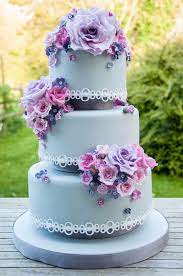 Three Tier Wedding Cake With White Lace Pink Purple Roses And Filler Blossom Berries Tiered Wedding Cake Wedding Cakes How To Make Cake