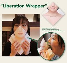 Female back burgers / female chef putting ingredients of burgers on a sliced. A Japanese Burger Chain Made Masks So Women Could Discreetly Eat Burgers First We Feast