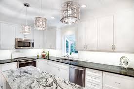 No terms and conditions applied, large or small, modern or classic in a colonial white kitchen like this one, a grey countertop is the finest option. Mastering The Two Tone Kitchen A Guide To Mixing Granite Colors