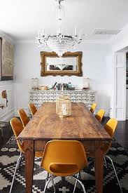 This dining room manages to be at once elegant and approachable, combining a friendly mix of details like its red brick fireplace, casual rug and refined upholstered dining chairs. Eclectic Dining Room Inspiration Eclectic Dining Chic Dining Room Dining Room Decor