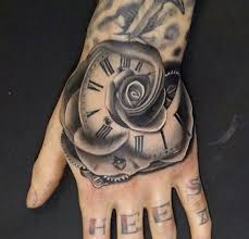 Flower Tattoo Hand Tattoo Tattoo Ideas Black White Tattoo Clock Tattoo Roman Numeral Hand Tattoos For Guys Hand Tattoos For Women Rose Hand Tattoo