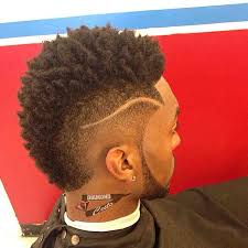 The curly mohawk hair is gaining a lot of popularity as of late. Curly Fade Mohawk Haircut