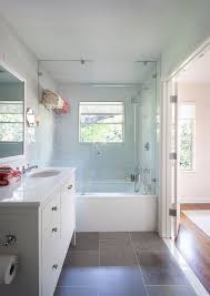 This dark hardwood floor has a bit of a cherry accent spilled throughout the planks. Bathroom White Vanity Dark Floor Image Of Bathroom And Closet