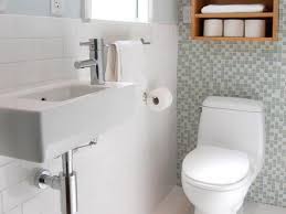 The shower curtain is hung on a track attached to the ceiling, adding to the height of the room, as well. Narrow Bathroom Layouts Hgtv