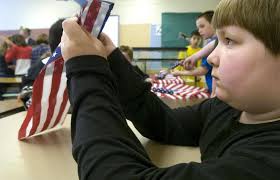 Soldotna class folds US flags to send to troops