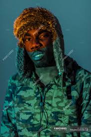 Contemptuous — i adjective abasing, abject, abominable, abusive, accusatory, arbitrary, arrogant, base, brazen, bumptious, calumniating, calumniatory, calumnious, challenging, compromising. Contemptuous Black Man In Warm Clothes And Hat With Orange Color On Face Winter Modern Stock Photo 223513456