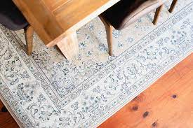 An area rug can bring warmth to cold tile floors and serve to visually divide the eating area from the food prep area in open concept kitchens. How To Choose The Right Dining Room Rug