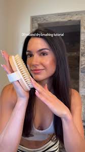Rubbing Dry Skin with Hair Brush