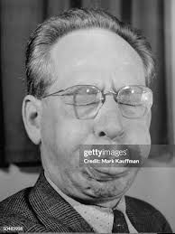 Composer Oliver Wallace making a face during rendition of his song... News  Photo