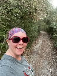 Any State parks with nice paved bicycle riding paths,at least ( 10 to 20  miles) perhaps that you could manage in a daytrip from the Houston area.