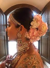 A floral wreath like this one made of rhinestones, pearl beads, and metal enamel flowers will accentuate your bridal hairstyle and will give you all the sparkly benefits of a tiara. Floral Buns On Brides Anushka Sharma Wedding Hairstyle Inspired The Urban Guide