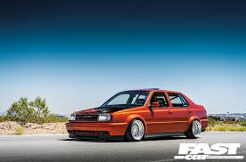 It is a custom boser hood, joey modded headlights w/ fogs, painted rub strips, badgeless grill, and gli front lip. Pit Crew Modified Vw Jetta Fast Car