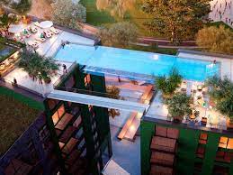 Swimmers will access it through a rotating spiral staircase based on the door of a submarine that rises from the pool floor. Floating Above London This Invisible Pool Lets You Swim Laps In The Sky Sky Pool Cool Pools Pool