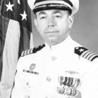 Capt. Ron Horton speaks to the crew and guests during a change of command  ceremony aboard USS Enterprise (CVN 65).