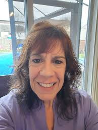 what hairstyle suits flat and wavy hair for a 58 year old woman?