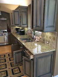 I know many people would have said we should have painted the cabinets, but adding the hardware made a big difference, and our friends thought we got new cabinets. Kitchen Cabinets Blonde Pickled To Medium Gray Modern Kuche Little Rock Von Falkner And Co Houzz