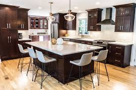 Brown Cabinet Kitchen With With White Quartz Countertops Large Kitchen Island White Tile Backspla Brown Kitchen Cabinets Brown Cabinets New Kitchen Cabinets