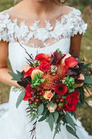 Custom real touch wedding bouquets, silk bouquets, boutonnieres, corsages, centerpieces and ceremony arrangements. Burgundy Fall Bouquet With Calla Lilies And Eucalyptus