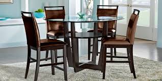 The area has a round dining table made out of wrought iron with a set of six matching dining chairs with. Shop Round Dining Room Table Sets