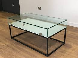This glass display coffee table is custom built in the shape of a small boat. Model Display Tables Collectors Display Case Klarity Glass Furniture
