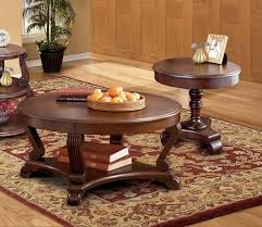 Signature design by ashley gambrey round endtable. Ashley Furniture Brookfield 3pc Coffee Table Set With Round End Table The Classy Home