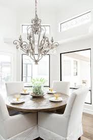 It is composed of vintage chandelier decorated of crystals, eight tufted chairs, big round table with. A Round Dining Table Allows For Easy Conversation Flow Here A Round Wood Dining Table Is Fitted Round Wood Dining Table Dining Table Gold Round Dining Table
