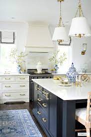 I added a few gold bottlebrush christmas trees and a bowl full of white and gold ornaments. Fall Kitchen Decor In Blue White Gold Citrineliving