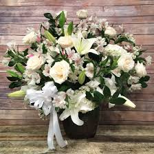 Mourners send flowers tot he funeral home and the funeral home staff displays them during the wake and funeral. Garden Funeral Floor Basket In New York Ny Flowers By Philip