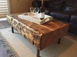 Combine reclaimed wood and casters to create a rugged coffee table with a touch of industrial chic, a beautiful centerpiece for your living room. Rustic Handmade Barn Beam Coffee Tables Sets Available Wood Coffee Table Rustic Wood Table Rustic Coffee Table Wood