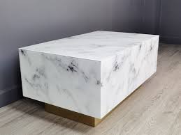 Next, glue a sheet of plywood to the top of the wooden rectangle to make a tabletop, and nail it into place to secure it. Everly Quinn Huitt Solid Coffee Table Reviews Wayfair