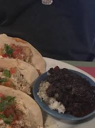 It gives them good flavor now its time to assemble the tacos! Fish Taco With Side Of Beans And Rice Picture Of Iguana Joe S Caribbean Bar Grill Aruba Tripadvisor